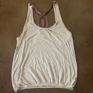 Grey tank top with detailed back size medium brand is love notes